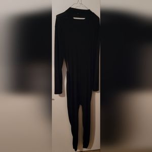 Black long sleeve catsuit, with open back.